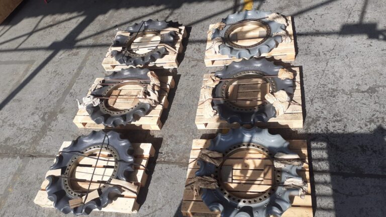 Six sprockets for O&K RH40 excavator, mounted on wooden pallets.